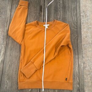 Orange size small athleta crew neck with zipper side pocket